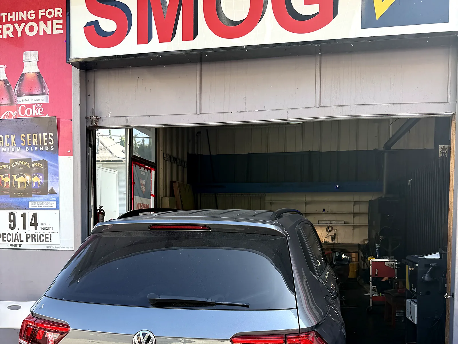 Change-of-ownership smog check in Los Angeles, CA: Volkswagen Tiguan at our Olympic Blvd station under the Smog sign