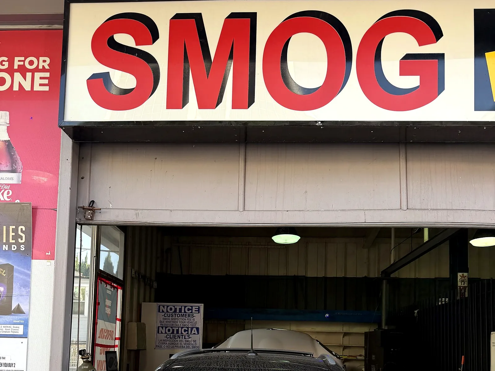 STAR smog check in Los Angeles, CA: our station entrance on Olympic Blvd with the Smog sign